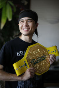 200 peeps world record, major league eating, Matt Stonie, 23, the world's newest competitive eating champion, holds the Nathan's Famous hot dog eating title belt at his home in San Jose, Calif., on Thursday, July 16, 2015. (Josie Lepe/Bay Area News Group)